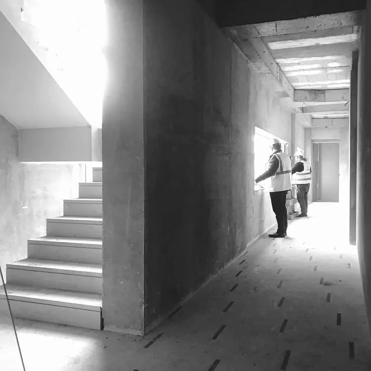 Concrete staircase and corridor in a residential building under construction